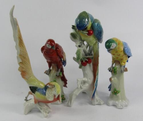 A pair of Sitzendorf porcelain figures of parakeets