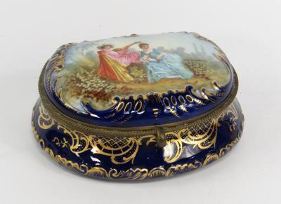 A Sevres style porcelain demi lune box and hinged cover