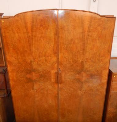 A 1920's figured walnut bedroom suite