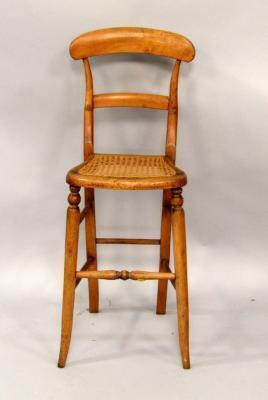 A Victorian child's oak correction chair