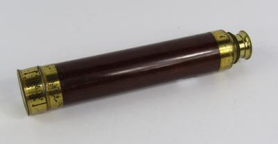 A mahogany bound brass three draw telescope