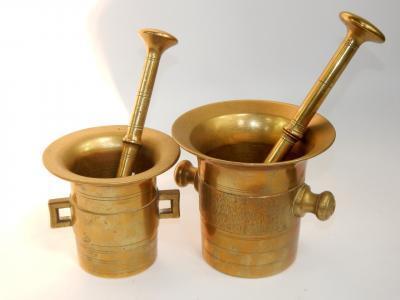 Two brass pestles and mortars