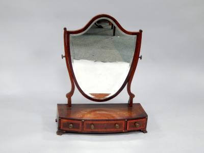 A Sheraton crossbanded mahogany dressing table mirror