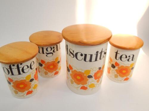 A set of four Crown Devon storage jars
