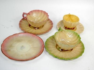 A group of Belleek porcelain nautilus shell tea cups and saucers