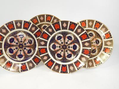 A set of nine Royal Crown Derby porcelain dinner plates