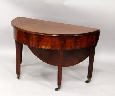 A mahogany drop leaf coffee table