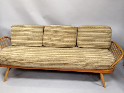 An Ercol light elm retro style sofa