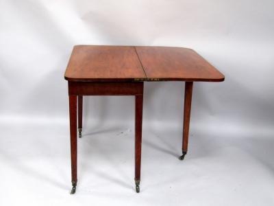 An early 19thC mahogany and boxwood strung tea table