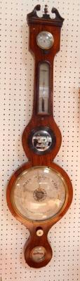A George III rosewood wheel barometer