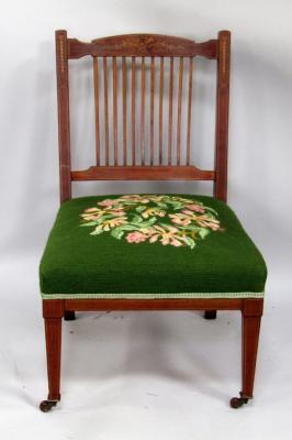 An Edwardian mahogany nursing chair
