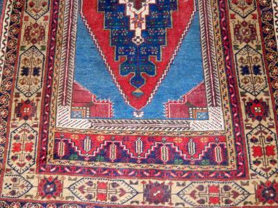 A Caucasian blue and red ground rug