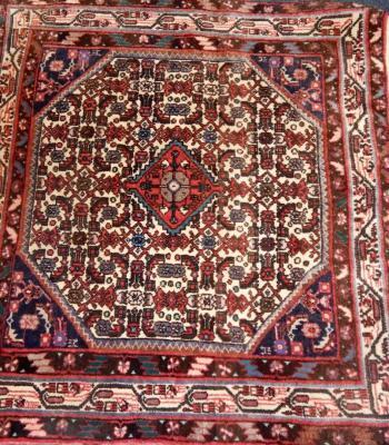 A Caucasian cream ground rug
