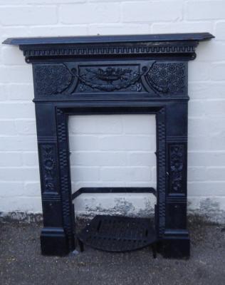 A Victorian cast iron bedroom fire surround