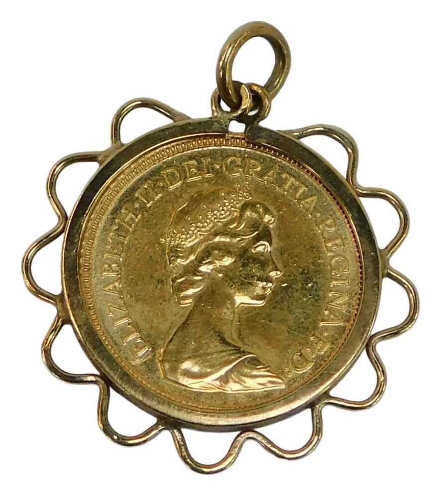 - An Elizabeth II gold half sovereign, dated 1982, in a 9ct gold mount ...