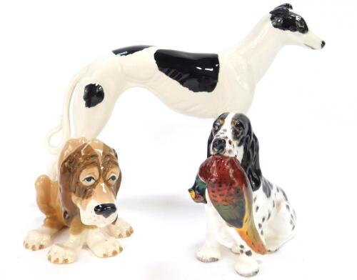 A Royal Doulton figure of a spaniel with a pheasant