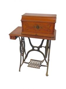 A Singer walnut and cast iron treadle sewing machine - 2