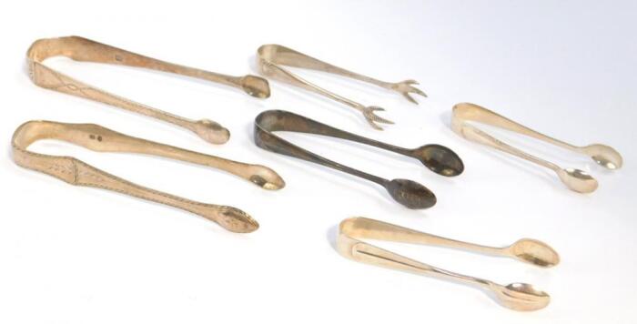 Two pairs of George III silver sugar tongs