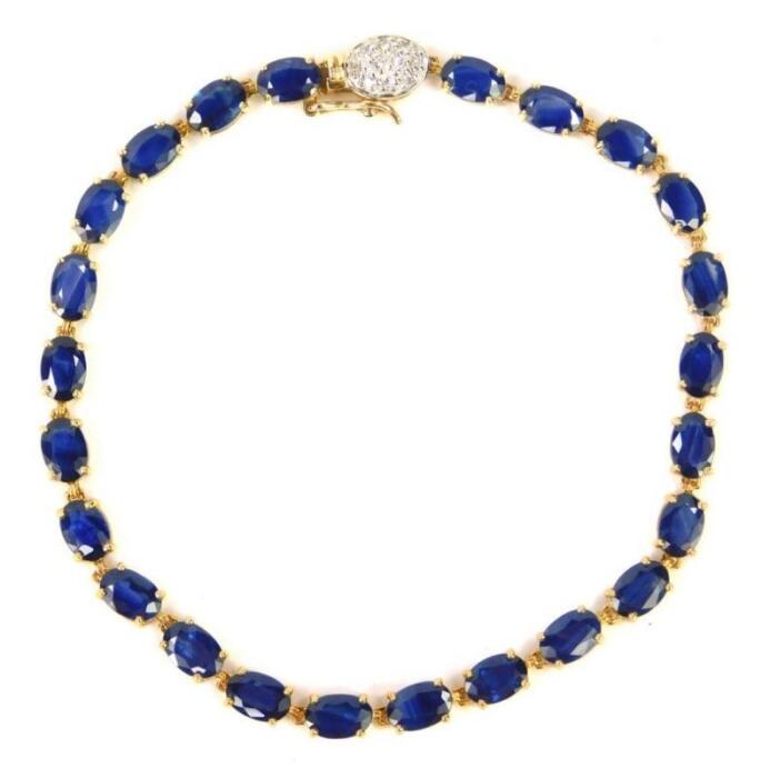 A 9ct gold and sapphire tennis bracelet