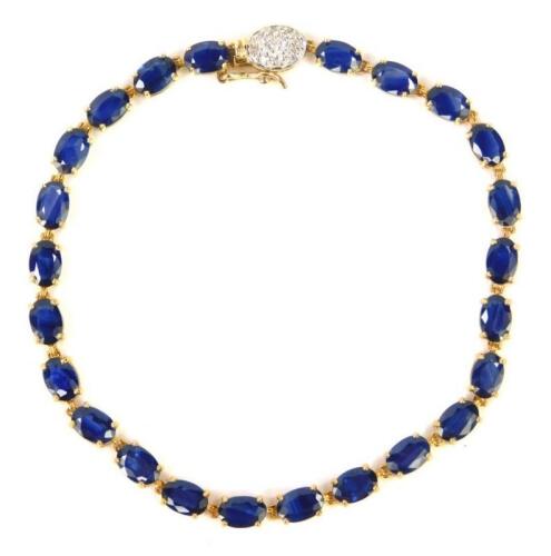 A 9ct gold and sapphire tennis bracelet