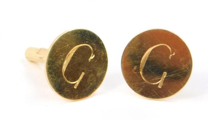 A pair of circular cufflinks