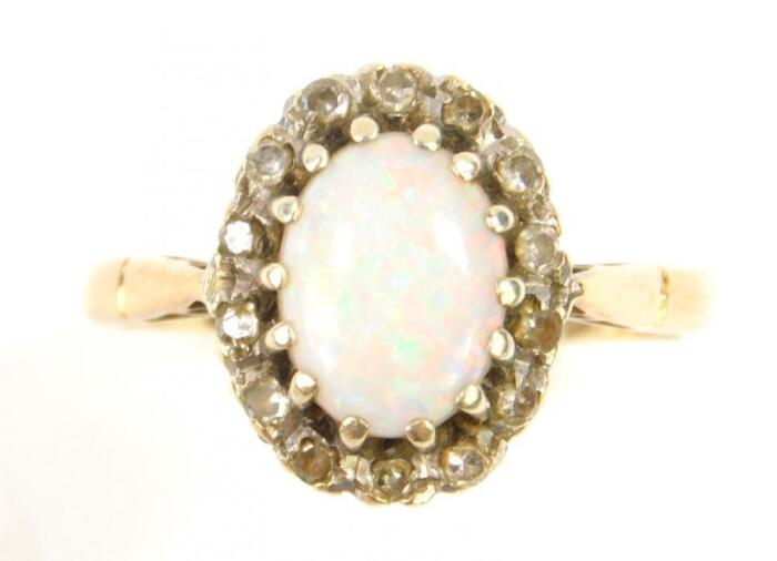 A 9ct gold and oval opal ring