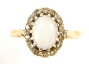 A 9ct gold and oval opal ring