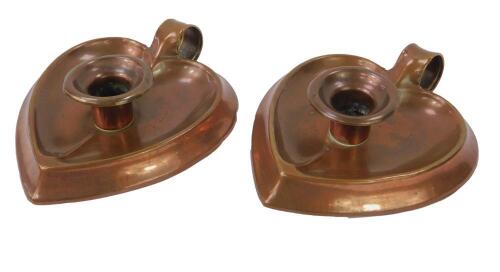 A pair of Joseph Sankey & Son Arts & Crafts copper chamber sticks