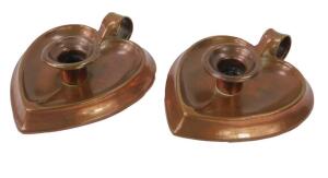 A pair of Joseph Sankey & Son Arts & Crafts copper chamber sticks