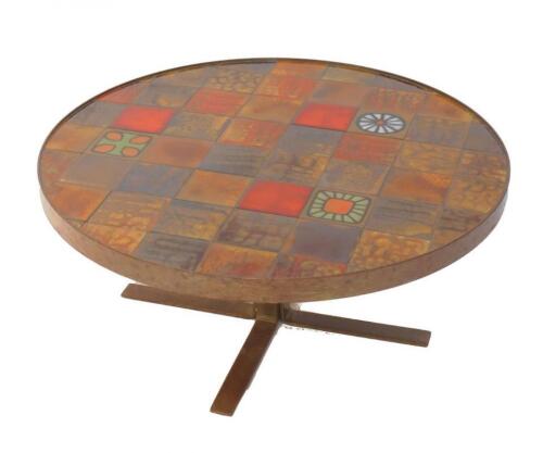 A 1970's cast metal and tile inset circular occasional table