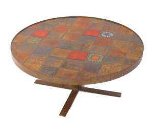 A 1970's cast metal and tile inset circular occasional table