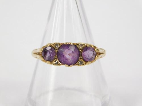 A 9ct gold and amethyst three stone ring