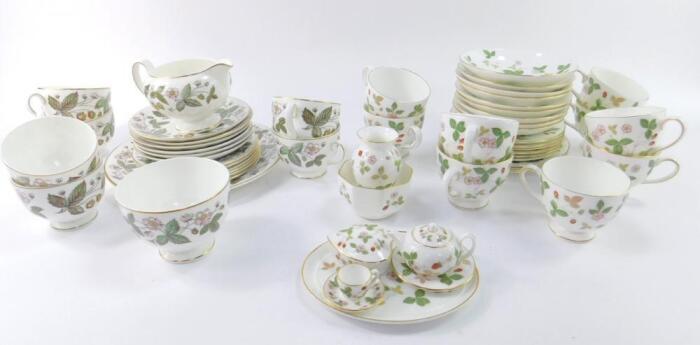 A Wedgwood porcelain part tea service decorated in the Wild Strawberry pattern