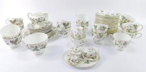A Wedgwood porcelain part tea service decorated in the Wild Strawberry pattern
