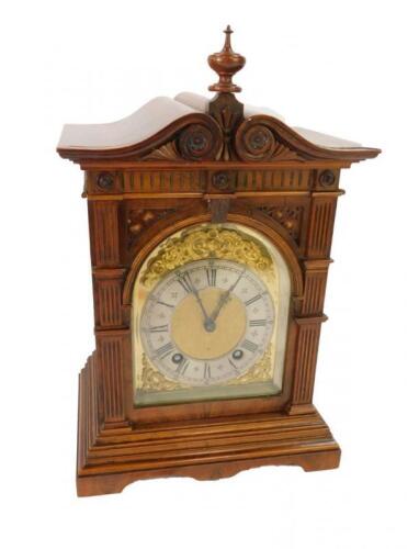 A Victorian walnut cased mantel clock
