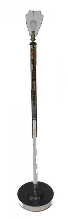 A mirrored glass standard lamp