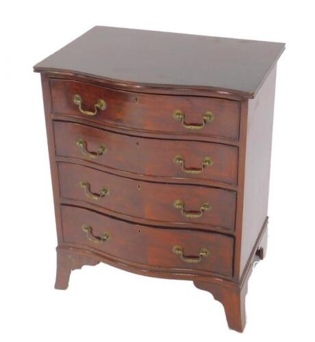 A Georgian style serpentine mahogany chest of drawers