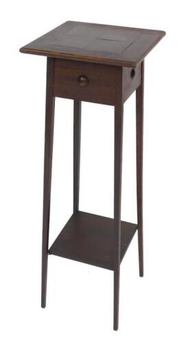 An Arts & Crafts late 19thC oak jardiniere stand