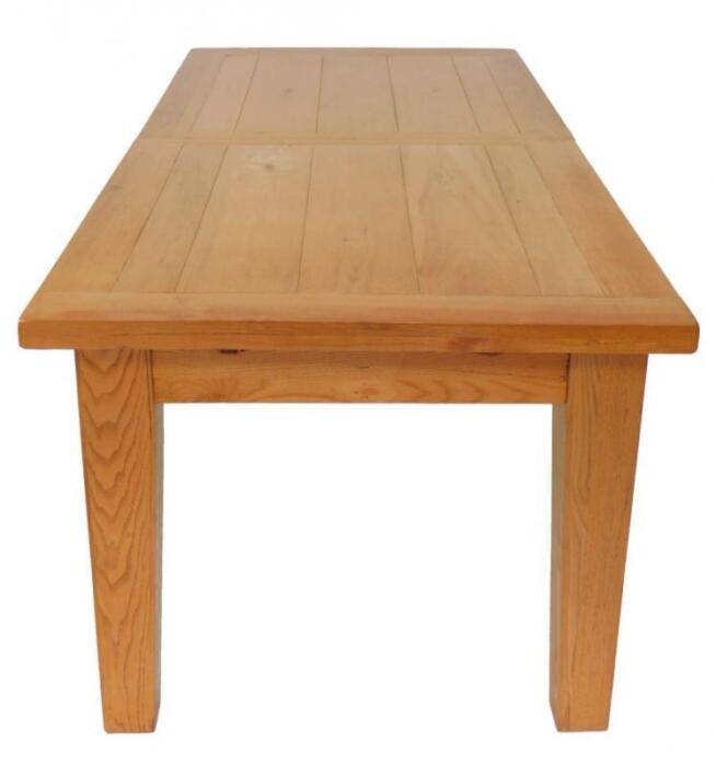 An oak plank top draw leaf dining table