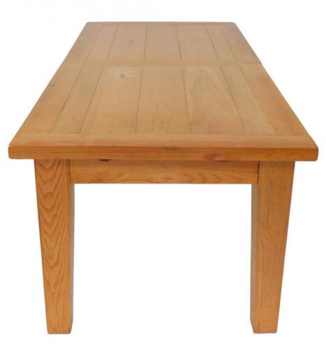 An oak plank top draw leaf dining table