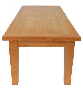 An oak plank top draw leaf dining table