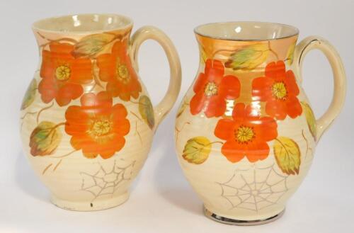 A pair of Arthur Wood pottery mid 20thC jugs