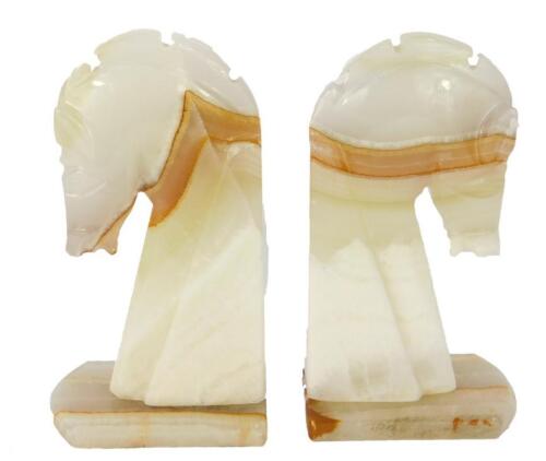 A pair of late 20thC green onyx bookends modelled as horse's heads