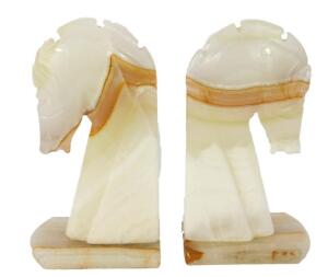 A pair of late 20thC green onyx bookends modelled as horse's heads