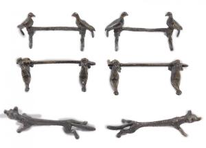 Three pairs of silver plated knife rests