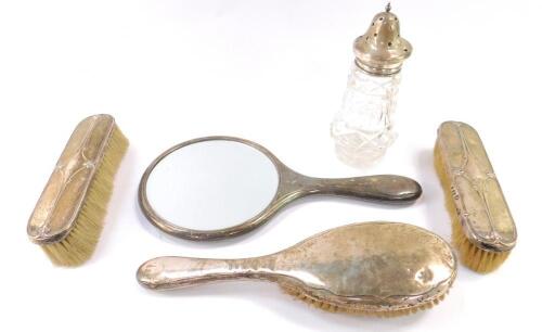 A pair of George V silver backed clothes brushes