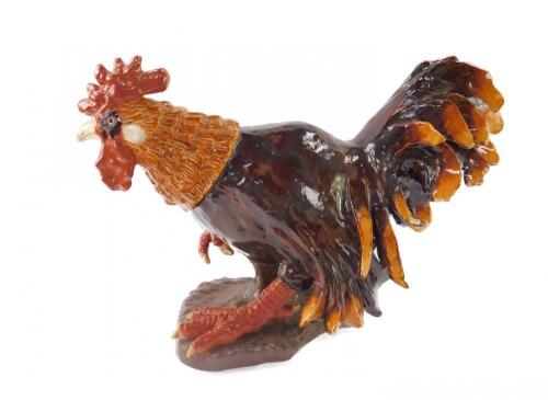 A large 20thC pottery figure of a rooster