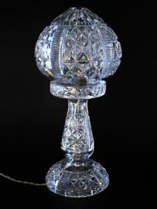 A cut glass table lamp and shade