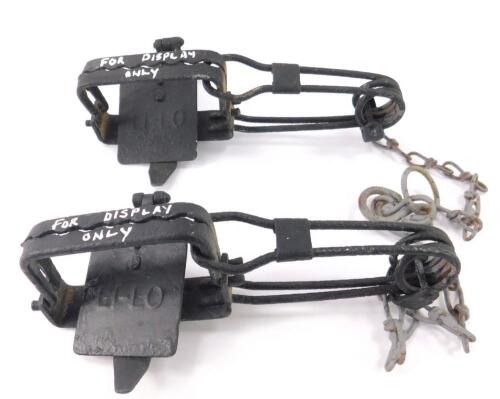 A pair of H Lane Li-Lo early 20thC ginn traps.