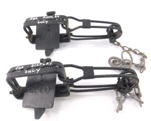 A pair of H Lane Li-Lo early 20thC ginn traps.